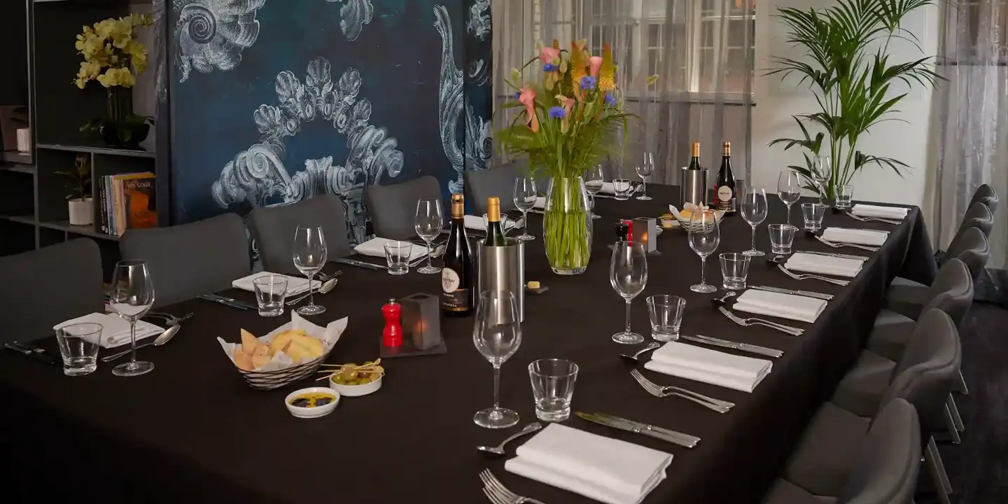 A table arranged with neatly set place settings.
