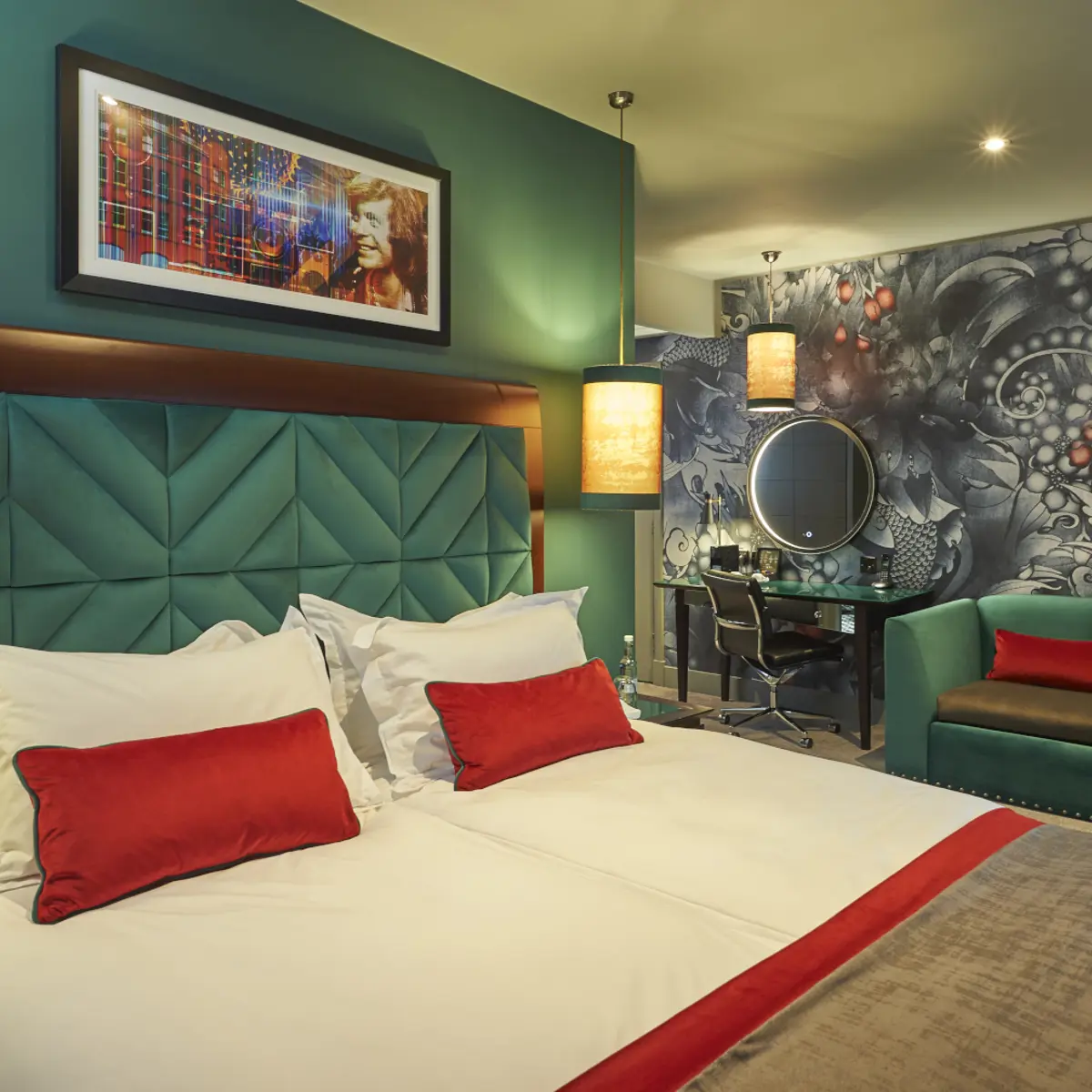 Spacious bedroom featuring a king-sized bed and a comfortable couch.