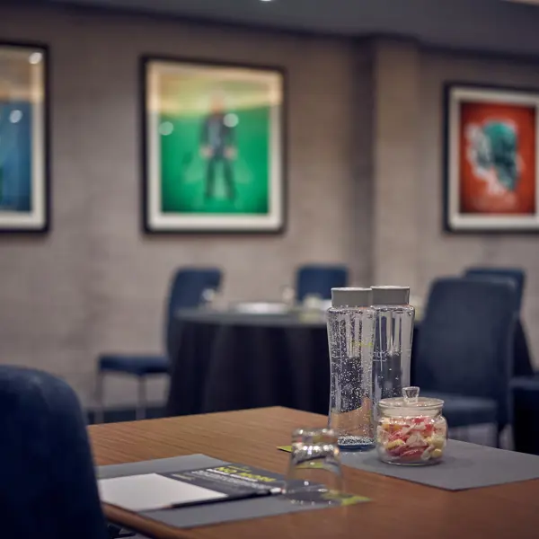 Table with a glass of water on it.