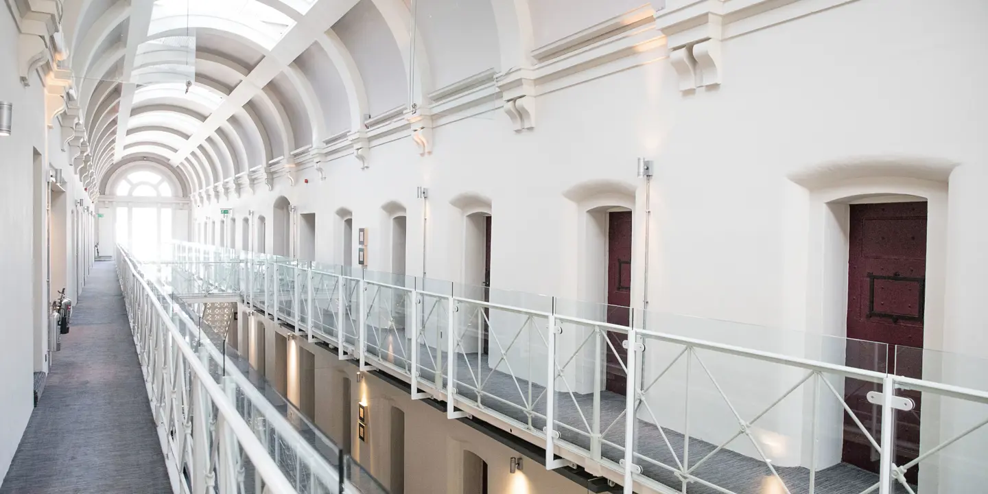 A long hallway with many windows.