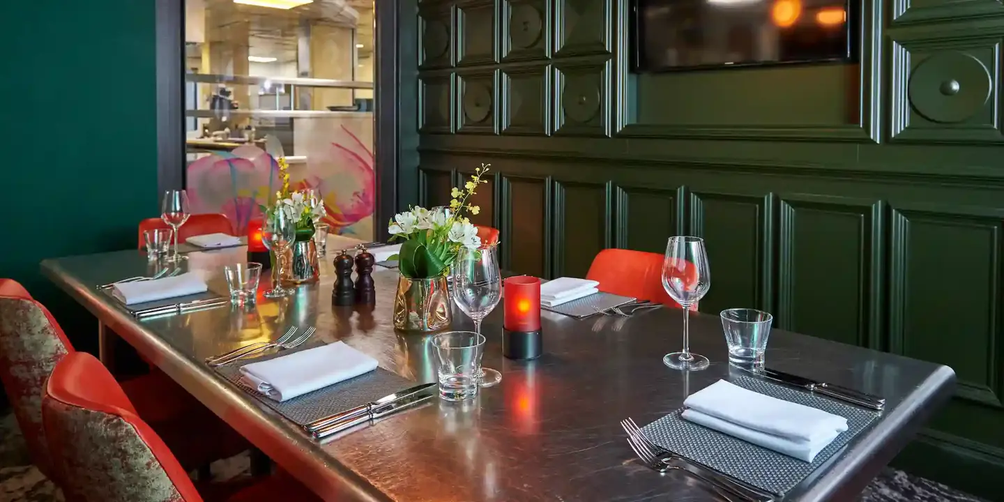 A beautifully arranged dining table with elegantly set place settings.