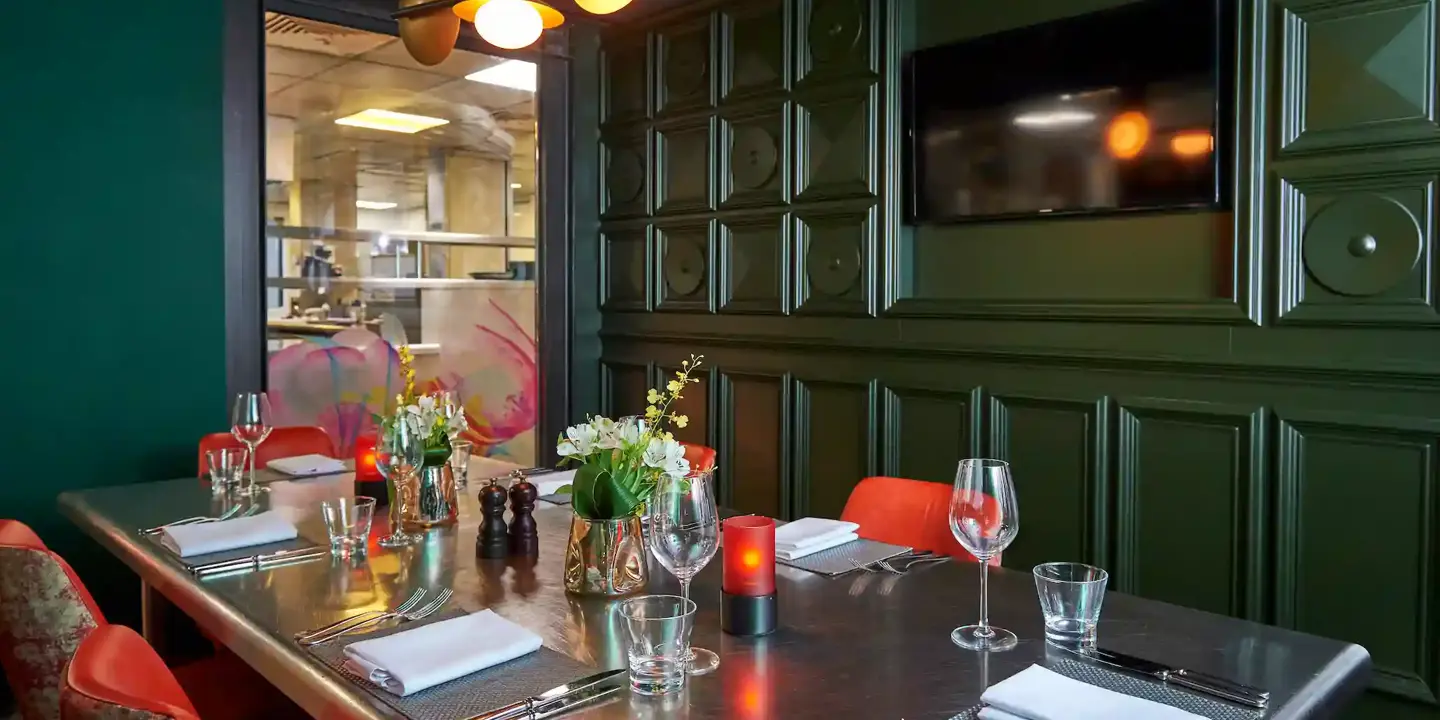 A beautifully arranged dining table with elegantly set place settings.