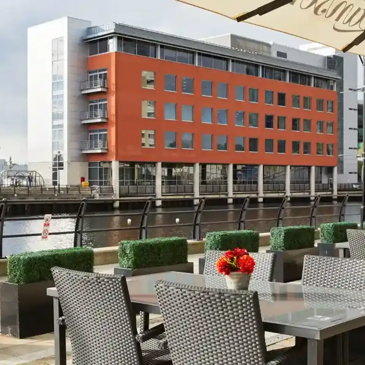 Outdoor dining area featuring tables, chairs, and umbrellas.
