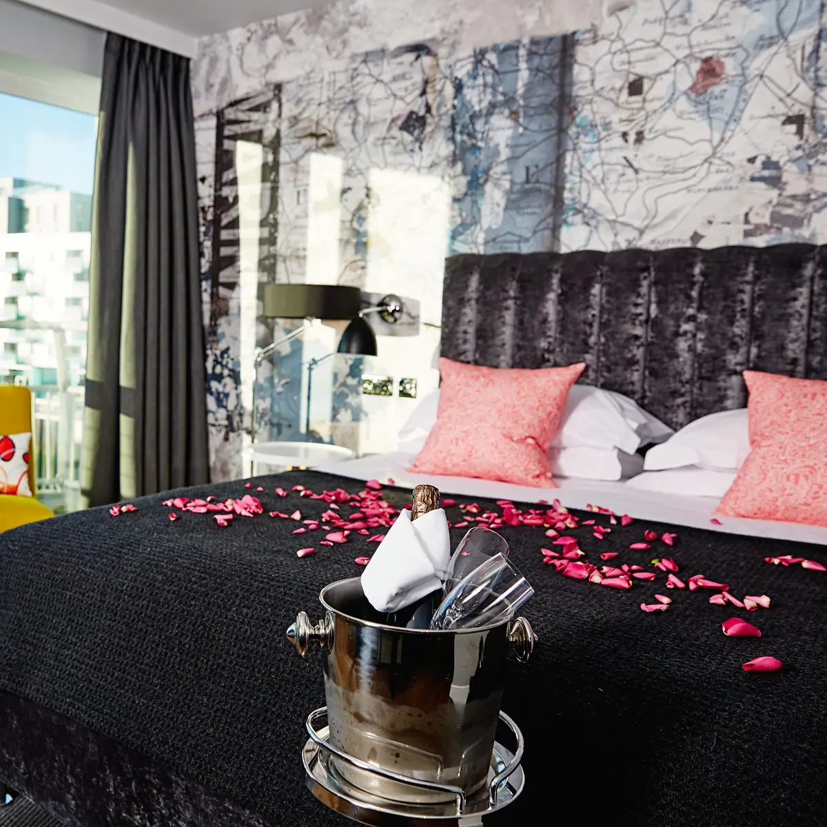 Bedroom in Malmaison Brighton covered in rose petals