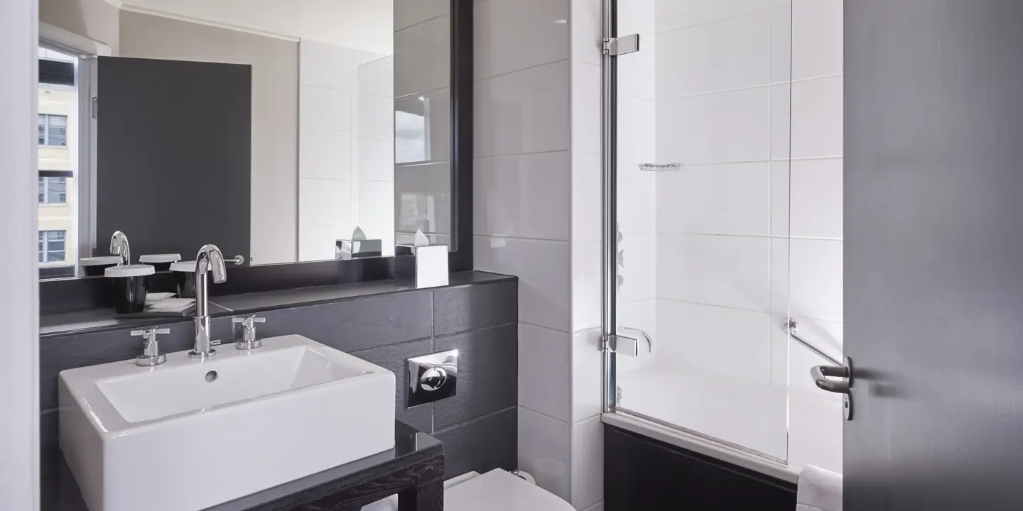 A bathroom featuring a sink, toilet, and shower.