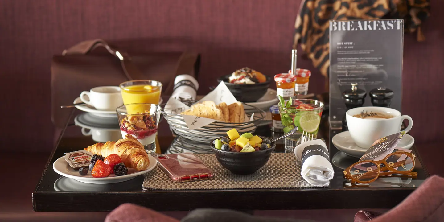 An assortment of breakfast foods and beverages arranged on a table.