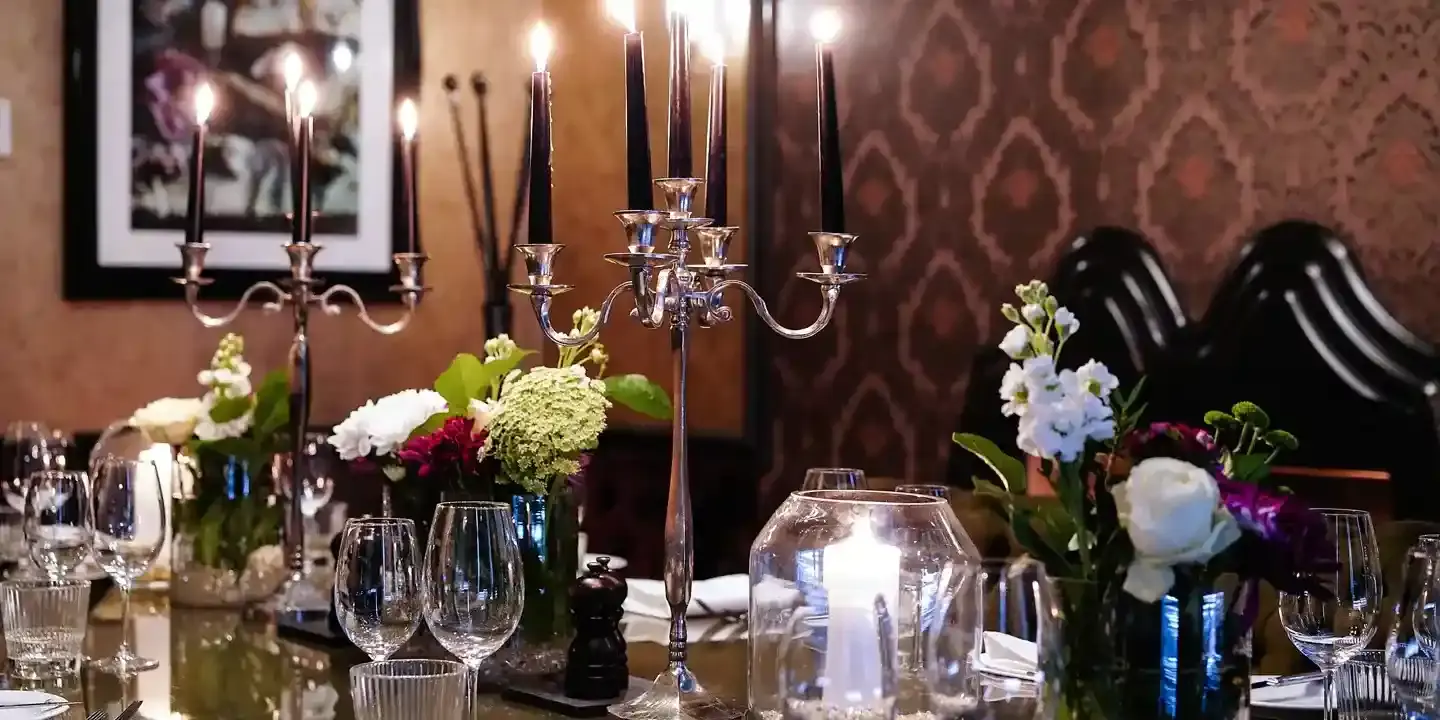 A table adorned with numerous wine glasses.
