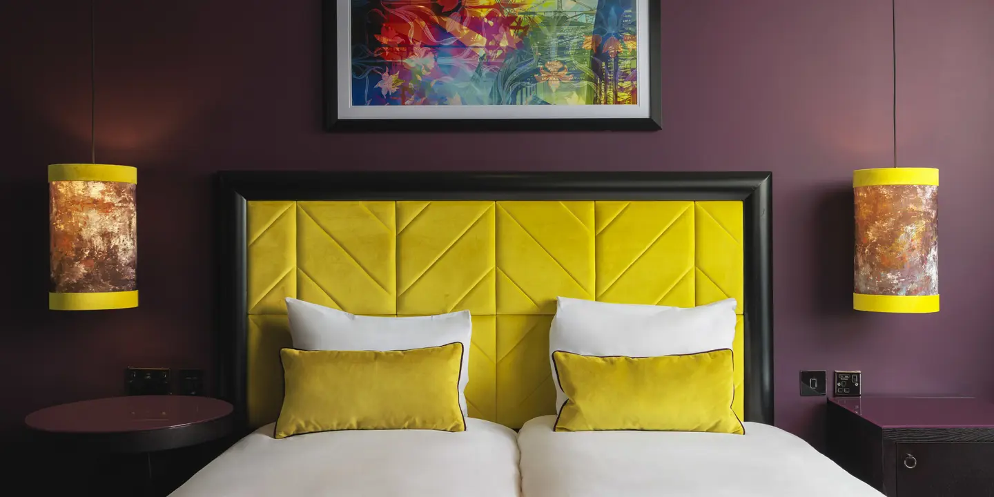 A luxurious twin bed, with stylish decor