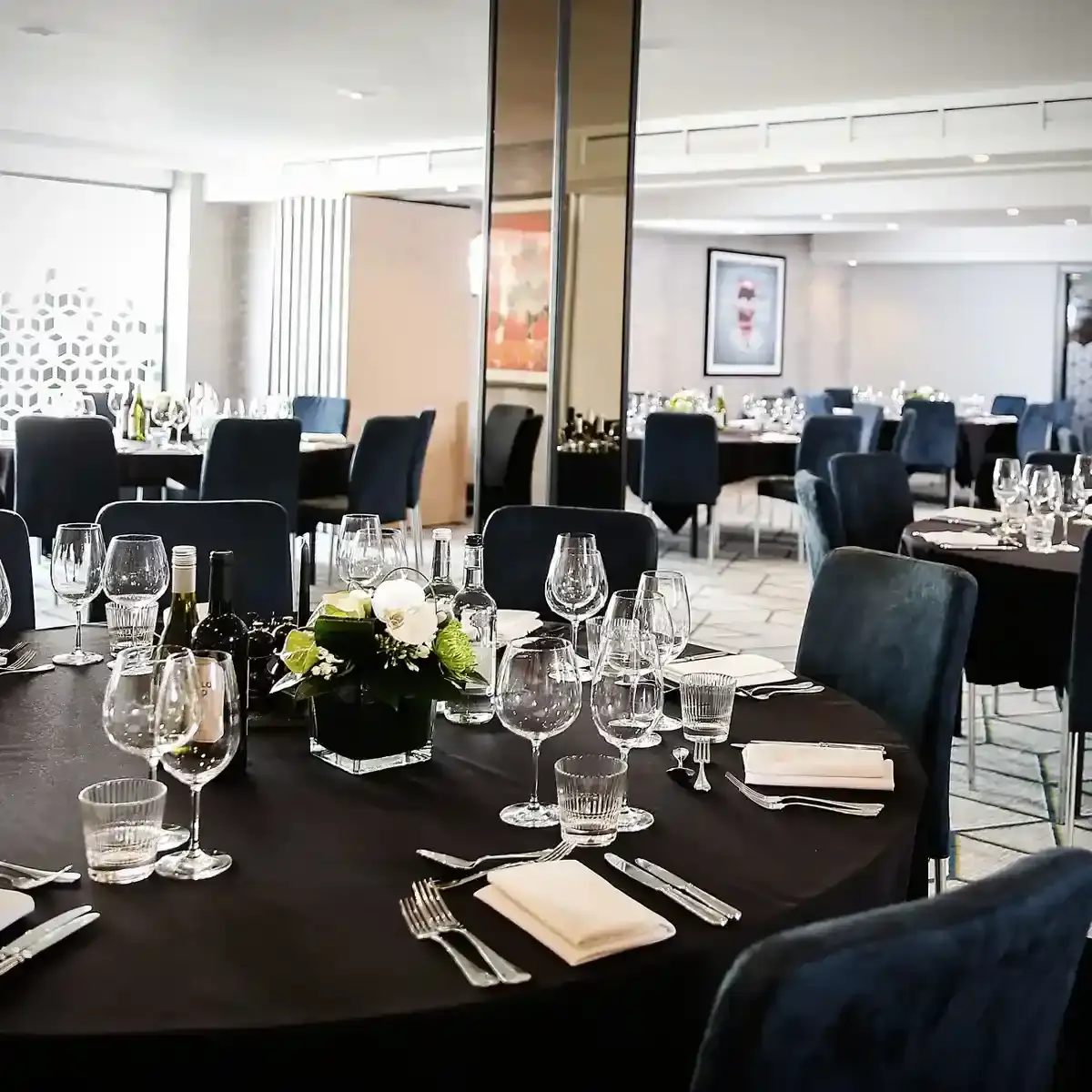 Table set for a formal dinner with place settings.