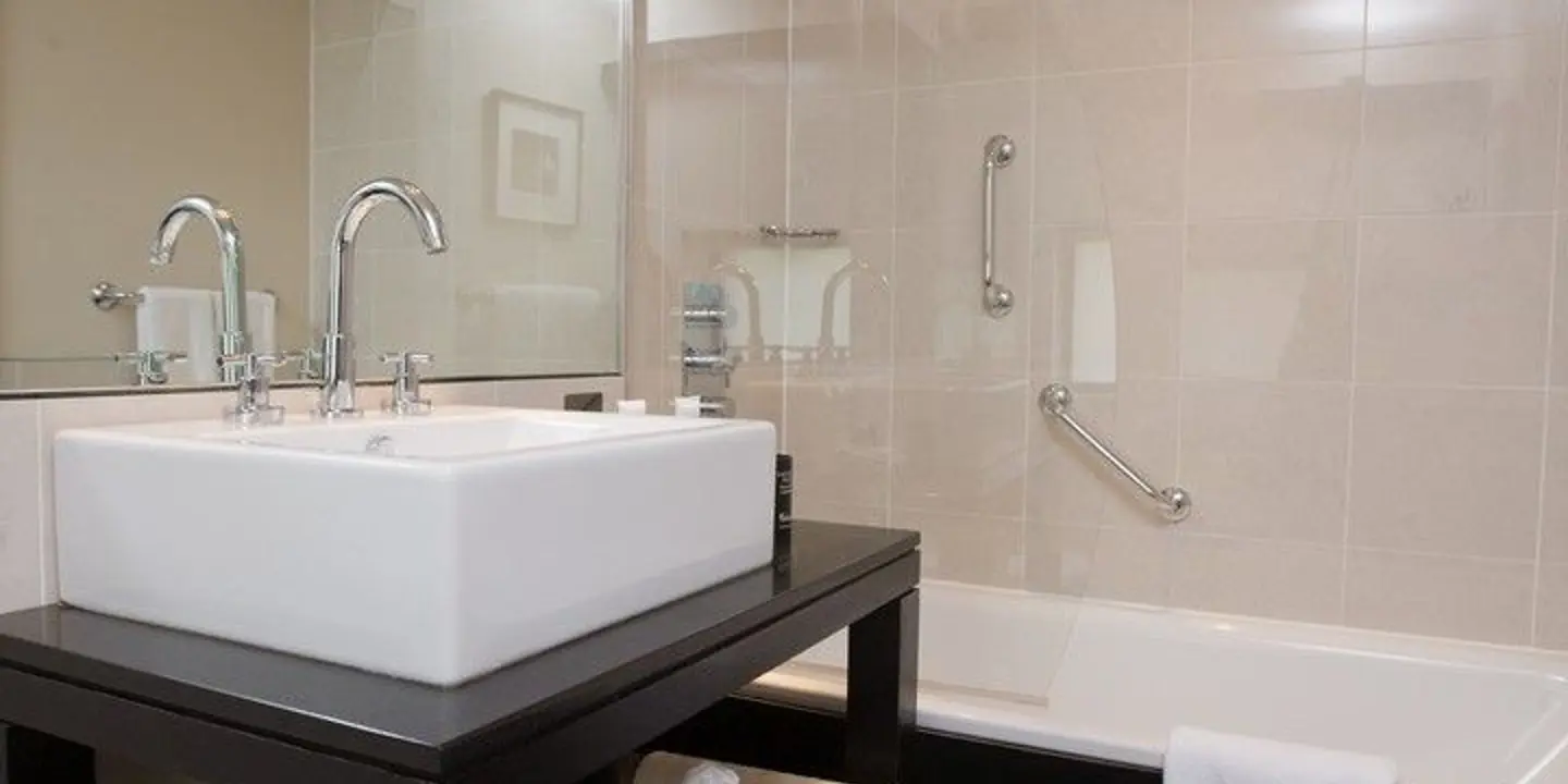 Bathroom featuring a sink and bathtub