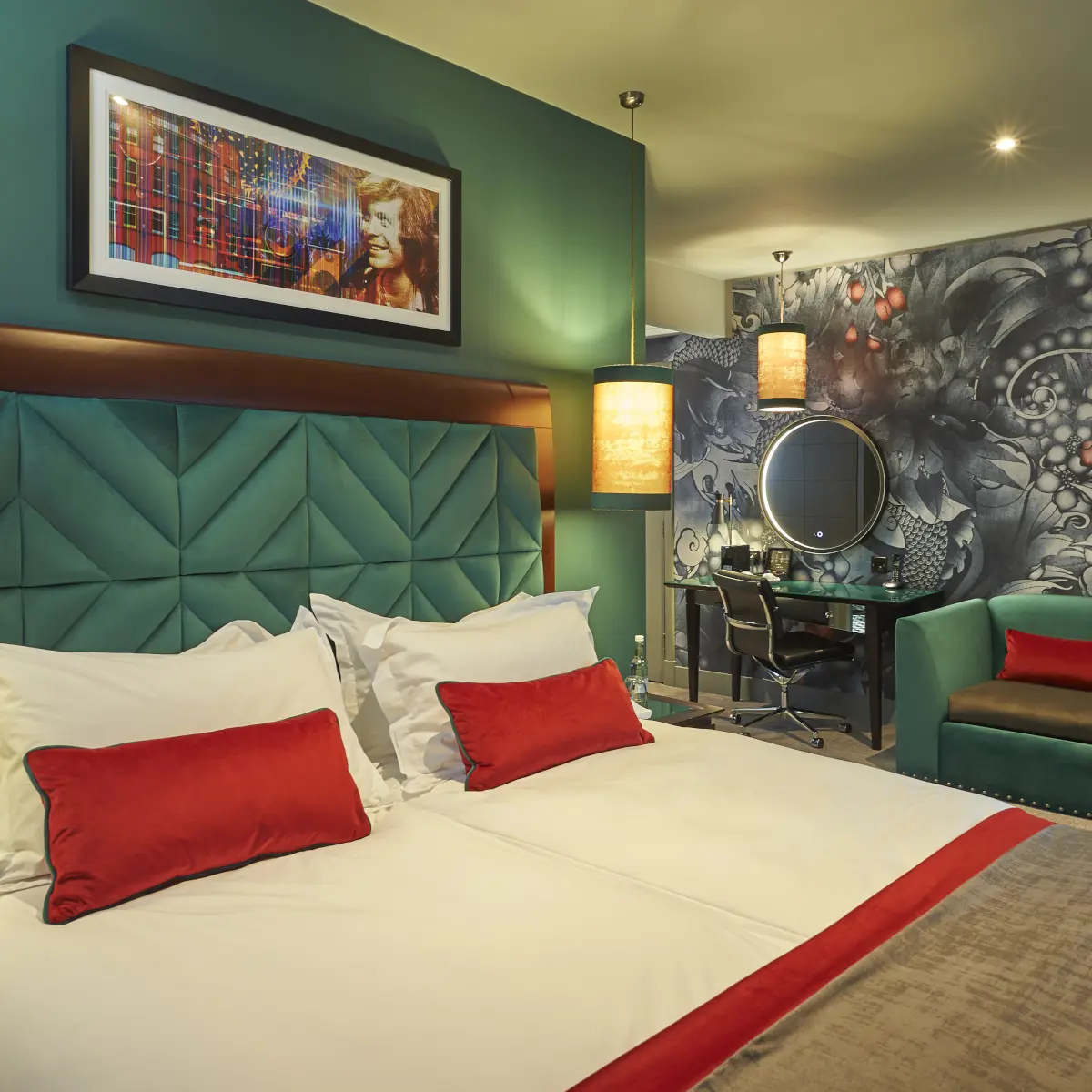 An elegantly furnished hotel room featuring a comfortable bed and a desk.