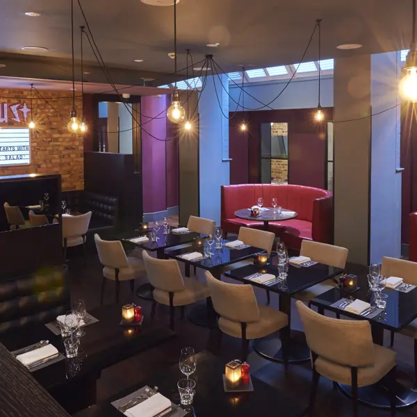 A spacious dining room filled with numerous tables and chairs.
