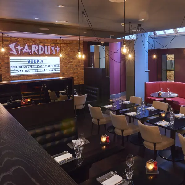 A spacious dining room filled with numerous tables and chairs.