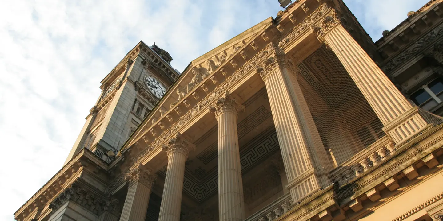 The Birmingham Museum in sunlight highlighting the stone pillars and architecture