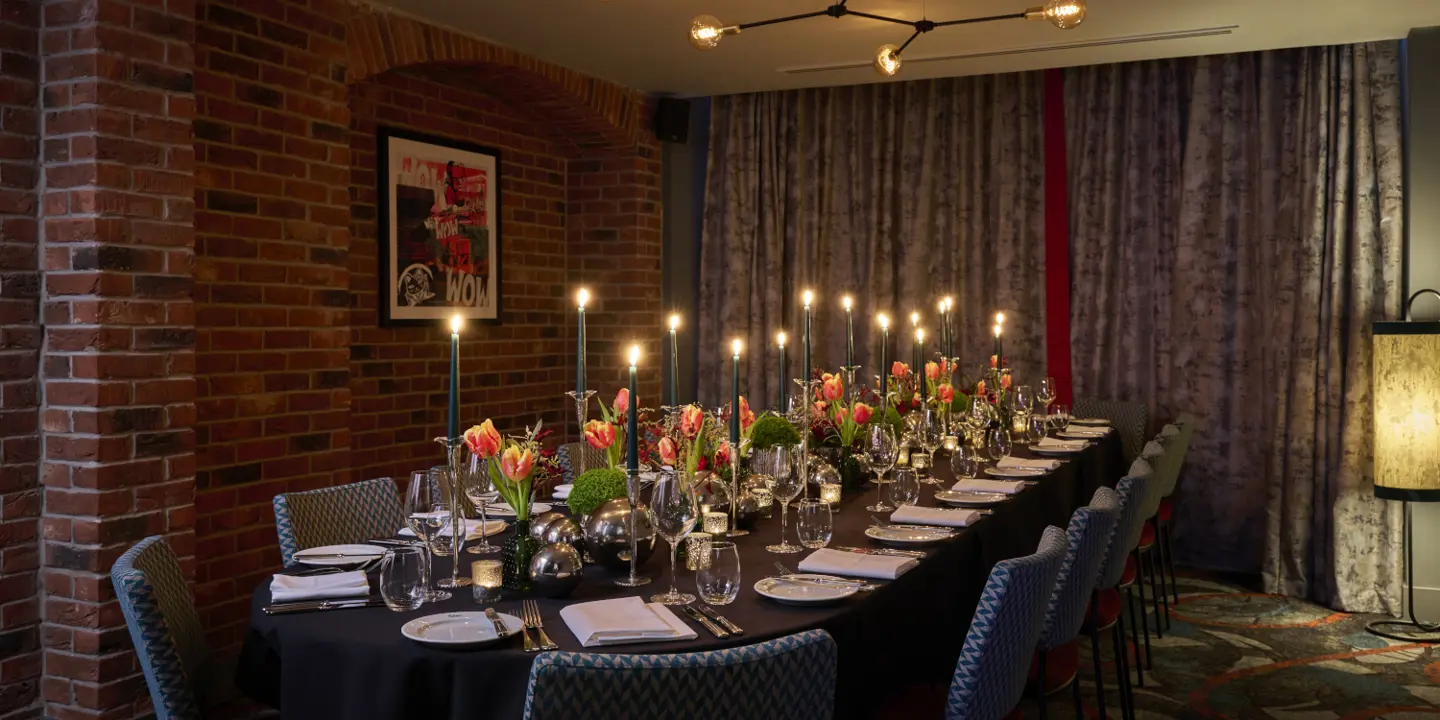 A table adorned with wine glasses and bottles of wine.