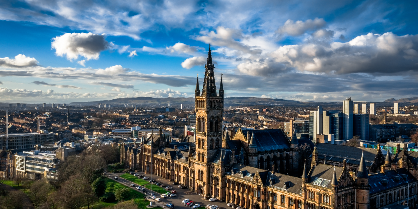 Aerial view of a spacious building featuring a clock tower.