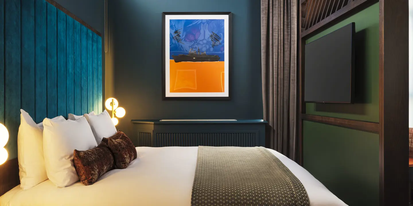 A bedroom featuring a wall-mounted tv.