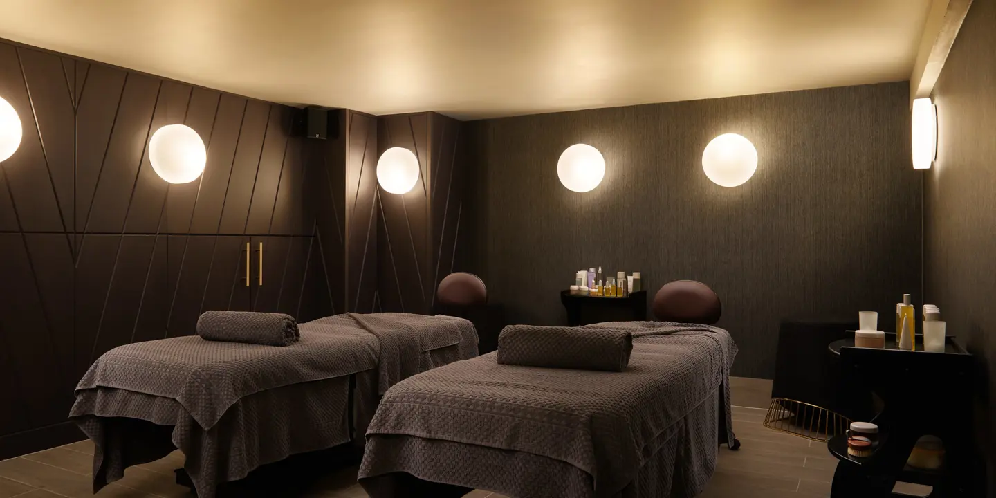 Two massage beds in a serene room.