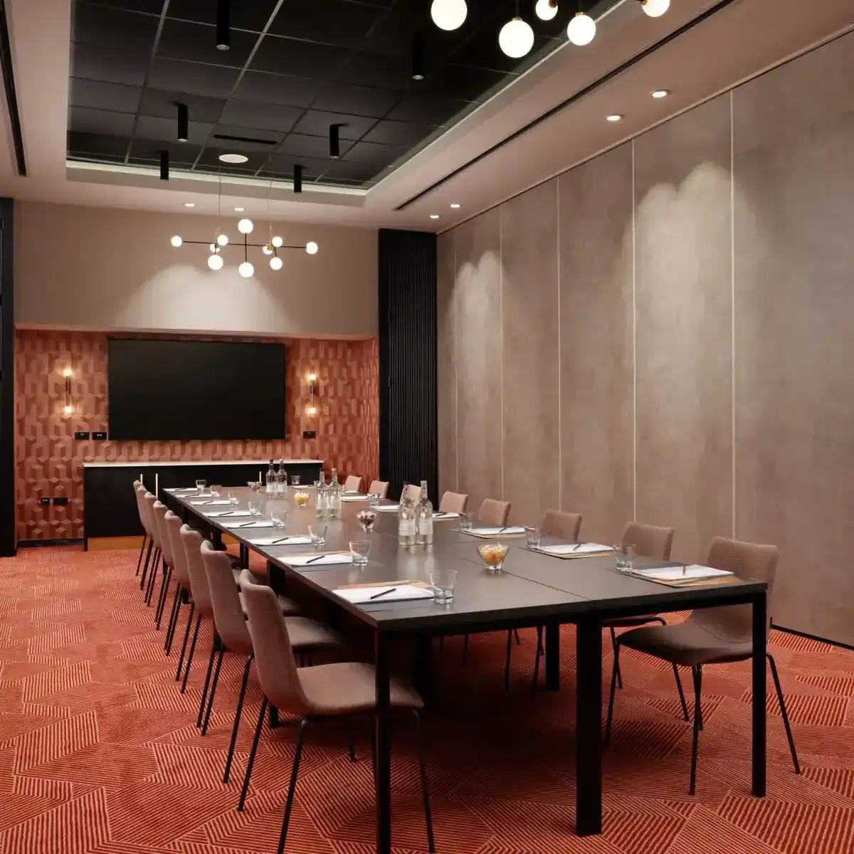 Conference room featuring a spacious table and chairs.