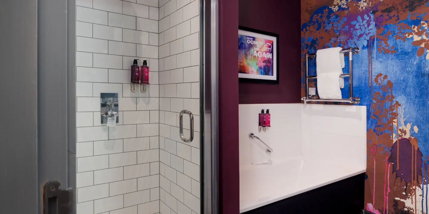 Bathroom featuring a toilet, sink, and bath.