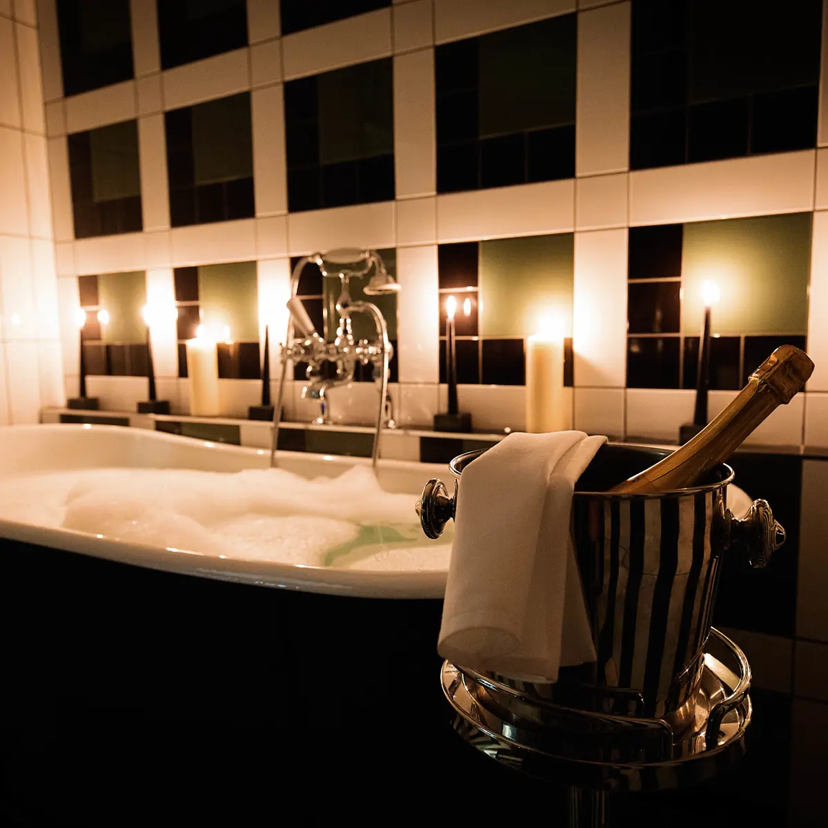 Champagne bottle placed in a bathtub.
