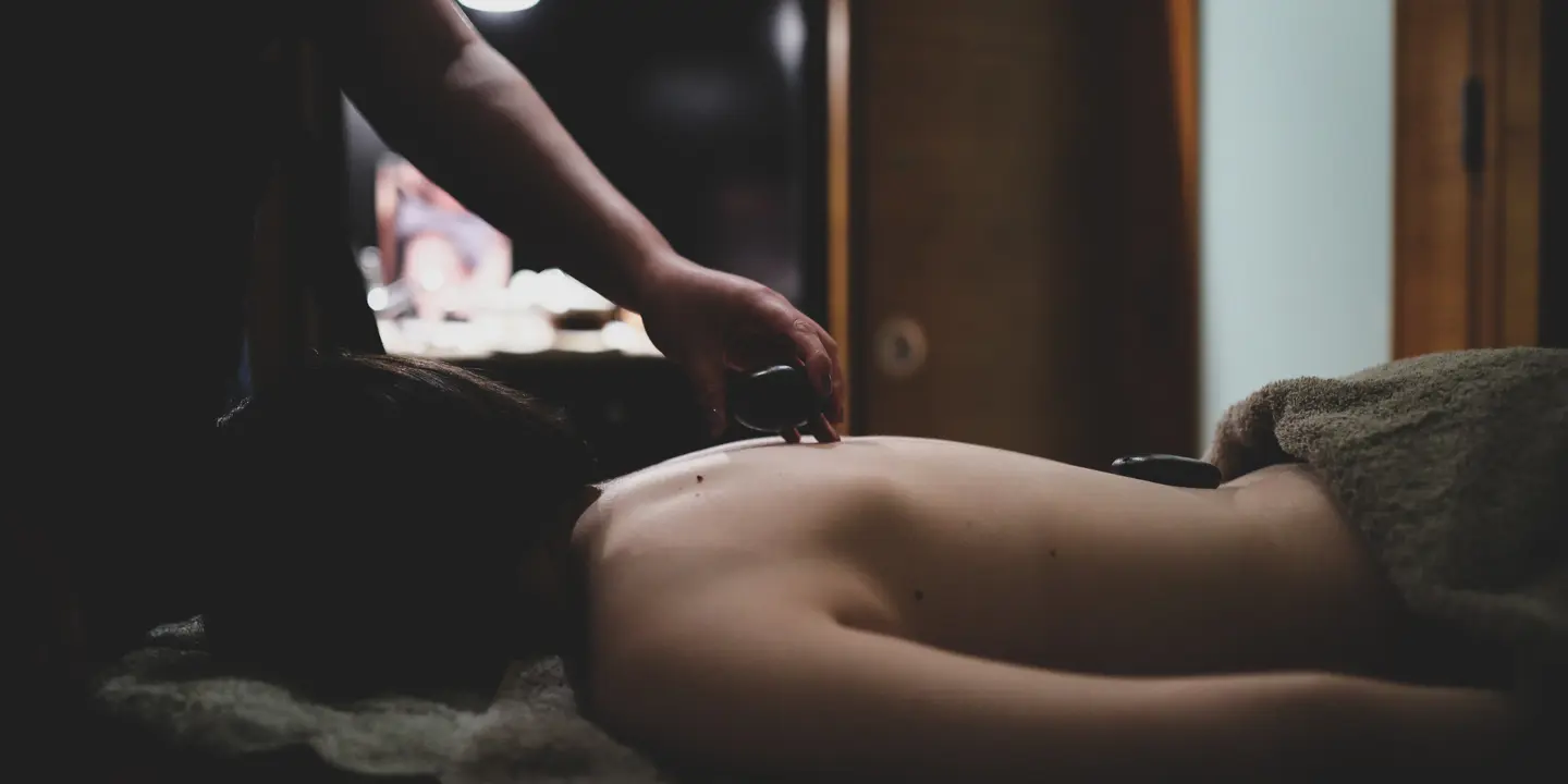 Spa Birmingham woman receives a hot stone massage treatment
