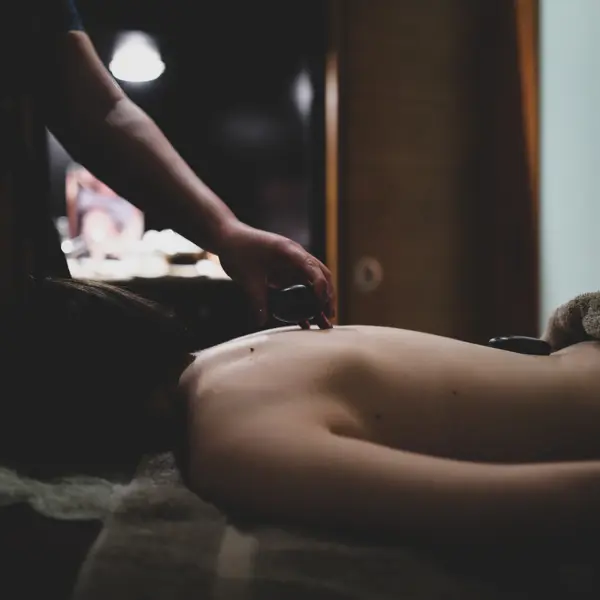 Spa Birmingham woman receives a hot stone massage treatment