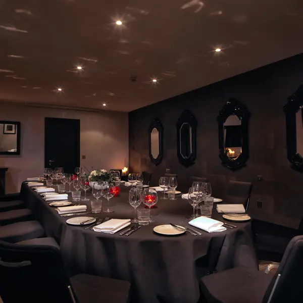 Rubislaw private dining room with atmospheric lighting showcasing a beautifully set table for a formal dinner.